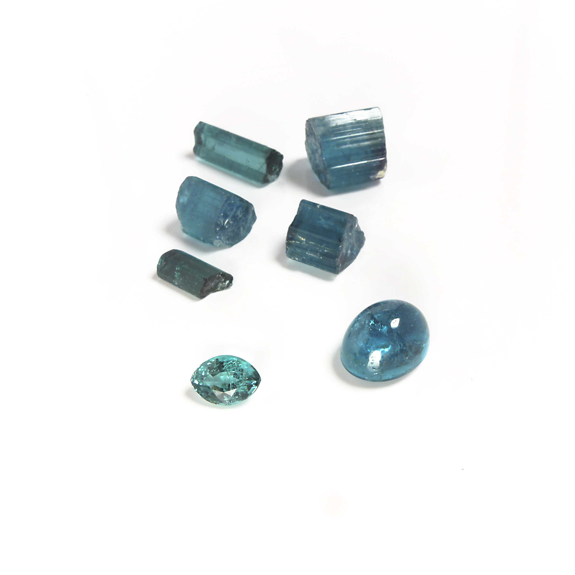 cut and rough blue turmalin stones